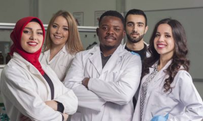 Photo of lab workers smiling