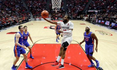 Photo of KJ Feagin shooting an acrobatic layup.