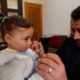 Photo of Abdullah Mohammed with his daughter, three-year-old Salwa inside a house he recently fled to, near the Syrian-Turkish border, in Sarmada, Syria