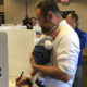 Photo of Andrew Janz voting with his daughter