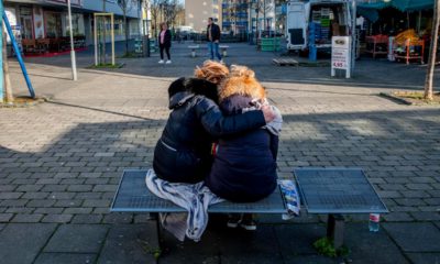 Photo of two women mourning in Germany