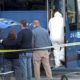 Photo of investigators outside of a Greyhound bus