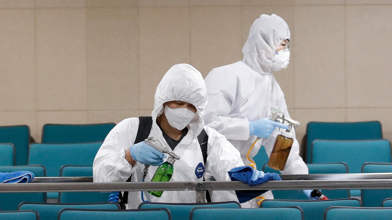 Photo of workers disinfecting a gym in South Korea