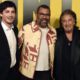 Photo of Jordan Peele, center, executive producer of the Amazon Prime Video series "Hunters," posing with cast members Logan Lerman, left, and Al Pacino