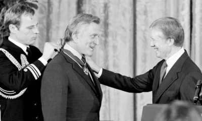 Photo of Jimmy Carter congratulating actor Kirk Douglas