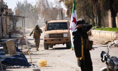 Photo of Syrian rebels entering the town of Saraqeb, in Idlib province, Syria