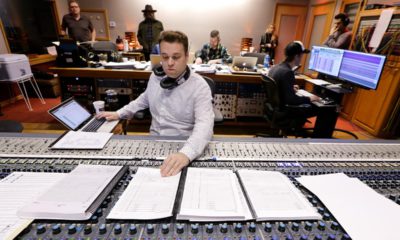 Photo of Nick Spezia working in a control room