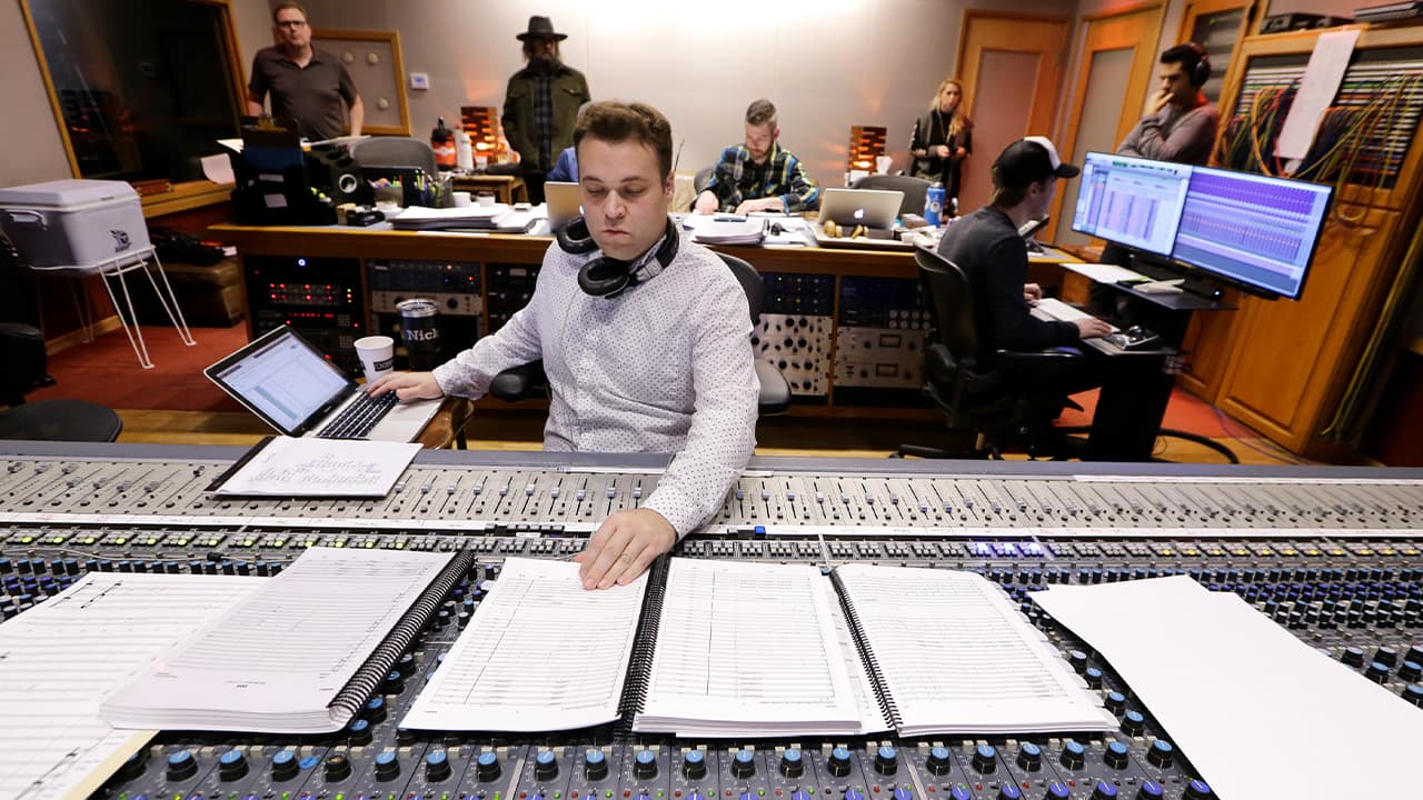 Photo of Nick Spezia working in a control room