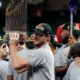 Photo of Washington Nationals starting pitcher Max Scherzer with the trophy after Game 7 of the baseball World Series against the Houston Astros in Houston