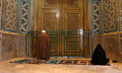 Photo of people praying in Qom