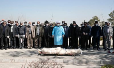 Photo of mourners praying over the body of former politburo official in the Revolutionary Guard Farzad Tazari