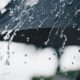 Photo of a black umbrella in the rain