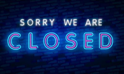 Neon "closed" sign at a bar