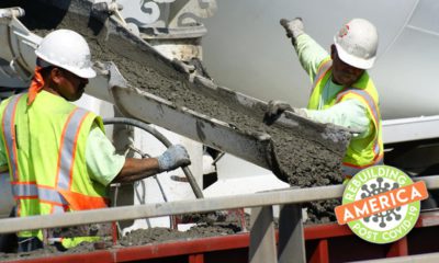 Construction workers pour concretecomposite