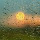 picture of sun poking through raindrops