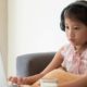 Photo of a young girl engaged in distance learning