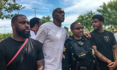 Photo of Quincy Pondexter and other Fresno residents showing up at River Park to protect stores against a "riot" promoted on social media by sources that are now under investigation