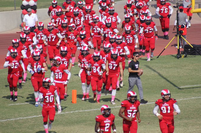 Fresno City College football team runs on to field