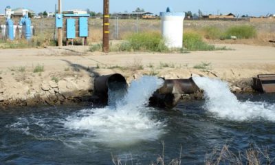 Photo of pumped groundwater flowing into a canal