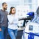 Photo of a man and woman shopping for a new car at a dealership