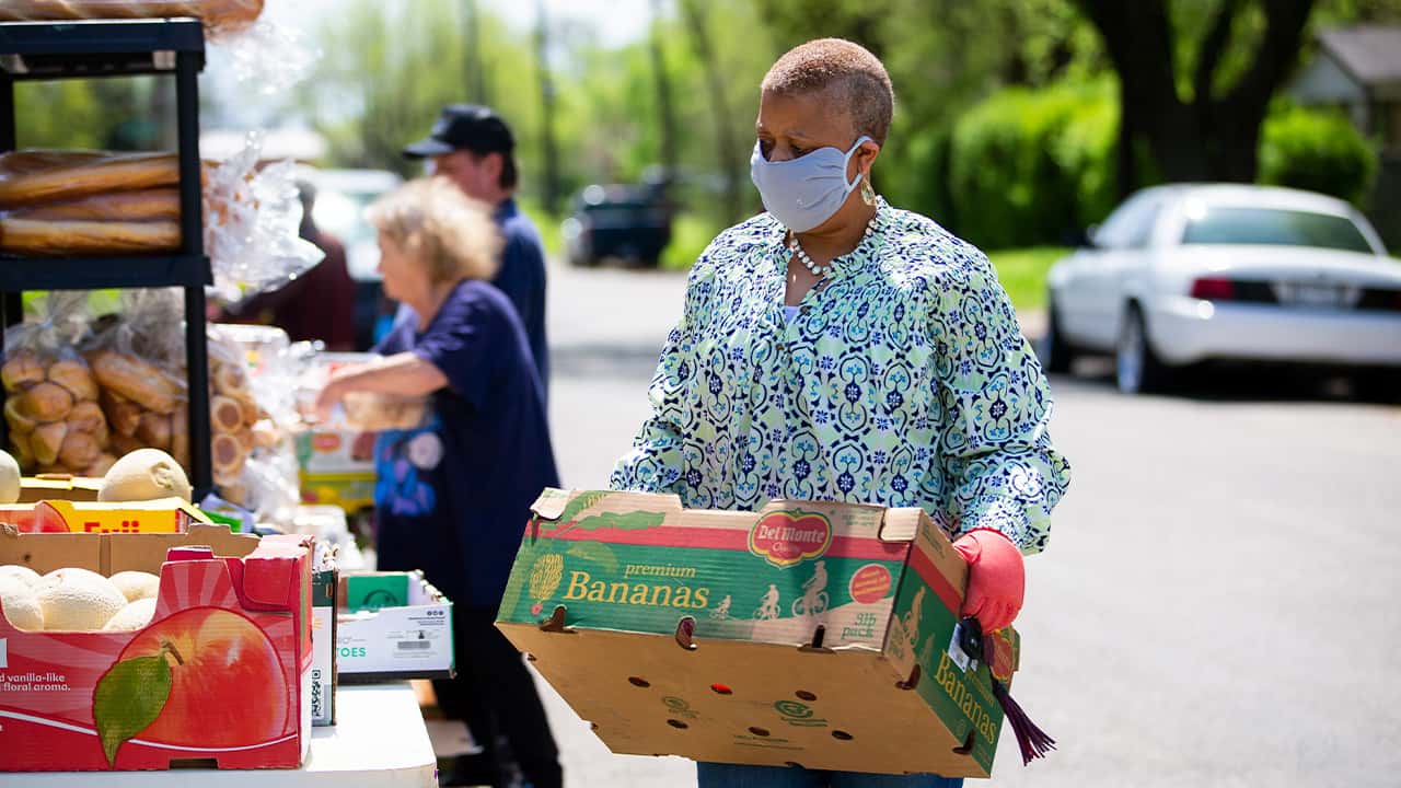 Image of people getting groceries at a food bank