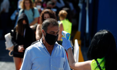 Photo of workers taking temperatures