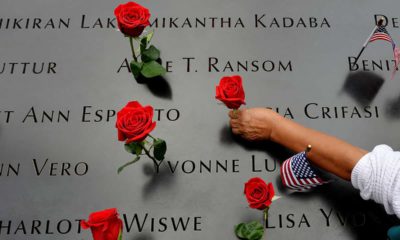 Photo of the names of 9/11 victims and roses