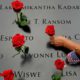 Photo of the names of 9/11 victims and roses