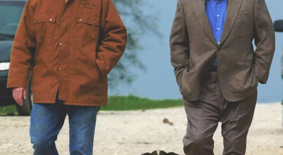 FILE- This Nov. 11, 2000 file photo shows then-Republican presidential candidate Texas Gov. George W. Bush and running mate Dick Cheney walk down a dirt road to meet with reporters, followed by Bush’s dog Spot, near Crawford, Texas. (AP Photo/Eric Draper, File)